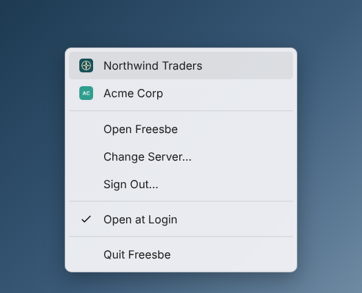 The tray menu: Northwind Traders and Acme Corp with their logos, then Open Freesbe, Change Server, Sign Out, Open at Login and Quit Freesbe